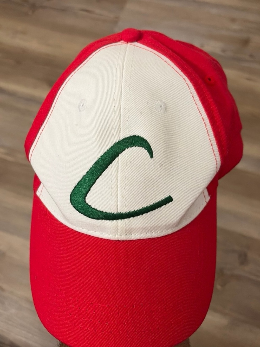 Pokemon Red and White Kids Baseball Cap with Green Emblem